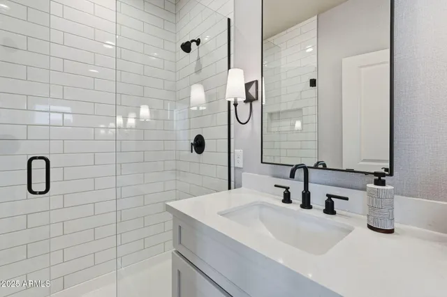 a bathroom with a sink and a mirror