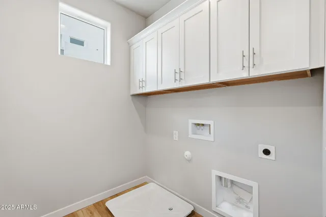 a bathroom with a sink and cabinets