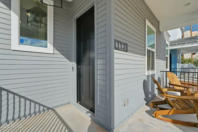 a view of a balcony with chairs