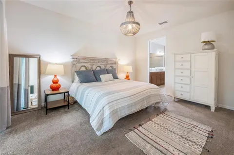 a kitchen with a sink a counter space and wooden floor