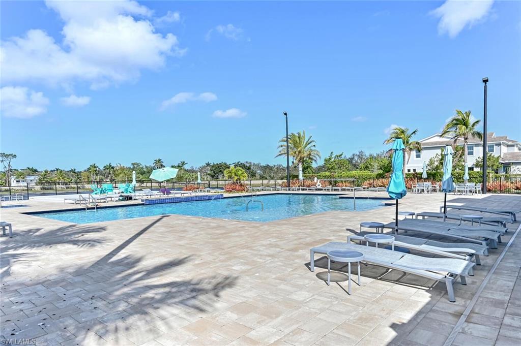 4720 Arboretum Circle, Unit 102 Naples, FL 34112 - Photo 33 of 44 a view of a lake with a terrace