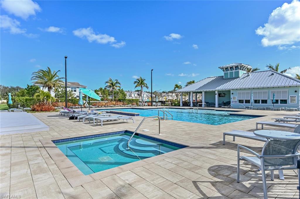 4720 Arboretum Circle, Unit 102 Naples, FL 34112 - Photo 34 of 44 a view of a house with swimming pool and sitting area