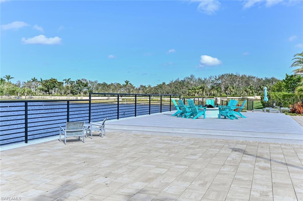 4720 Arboretum Circle, Unit 102 Naples, FL 34112 - Photo 37 of 44 a view of a terrace with a bench