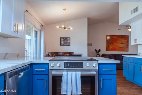 a kitchen with a stove and a sink
