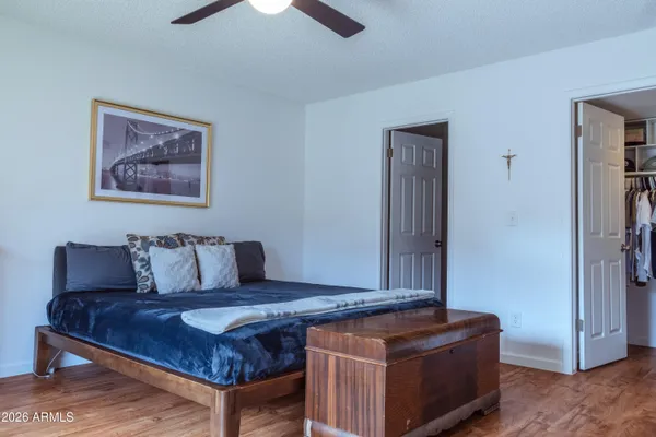 a view of a porch with furniture and a yard