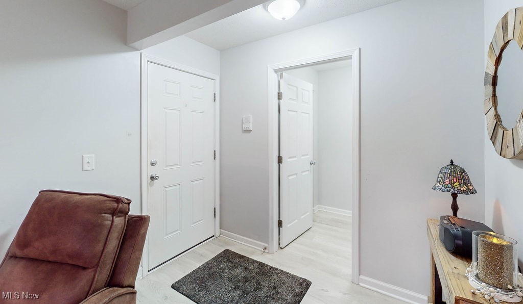 1005 Canyon View Road, Unit F Northfield, OH 44067 - Photo 3 of 28 Entryway featuring light hardwood / wood-style flooring