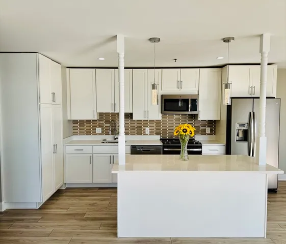 a view of living room with furniture and fireplace