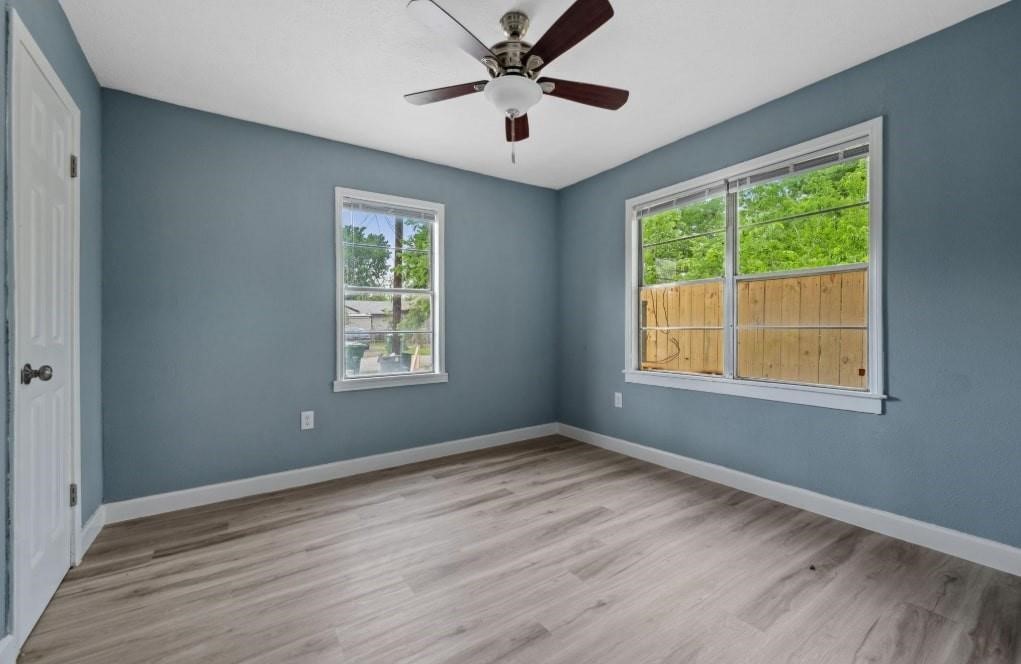 3423 Nettleton Street Houston, TX 77004 - Photo 5 of 14 a view of empty room with wooden floor and fan