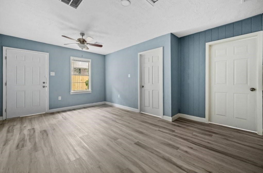3423 Nettleton Street Houston, TX 77004 - Photo 8 of 14 a view of an empty room with a window and wooden floor