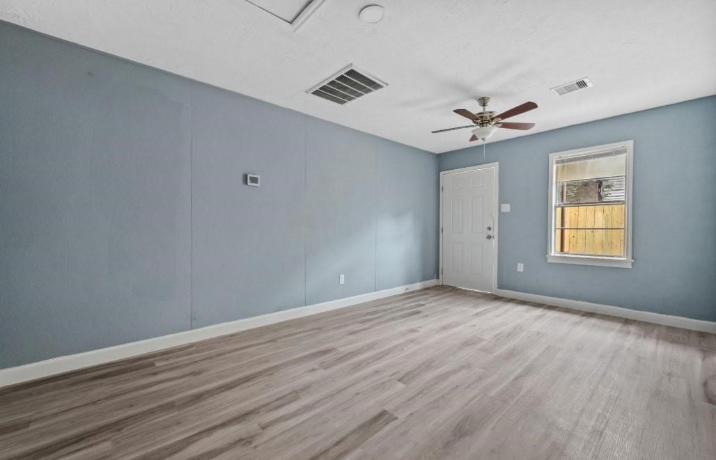 3423 Nettleton Street Houston, TX 77004 - Photo 9 of 14 wooden floor in an empty room with a window