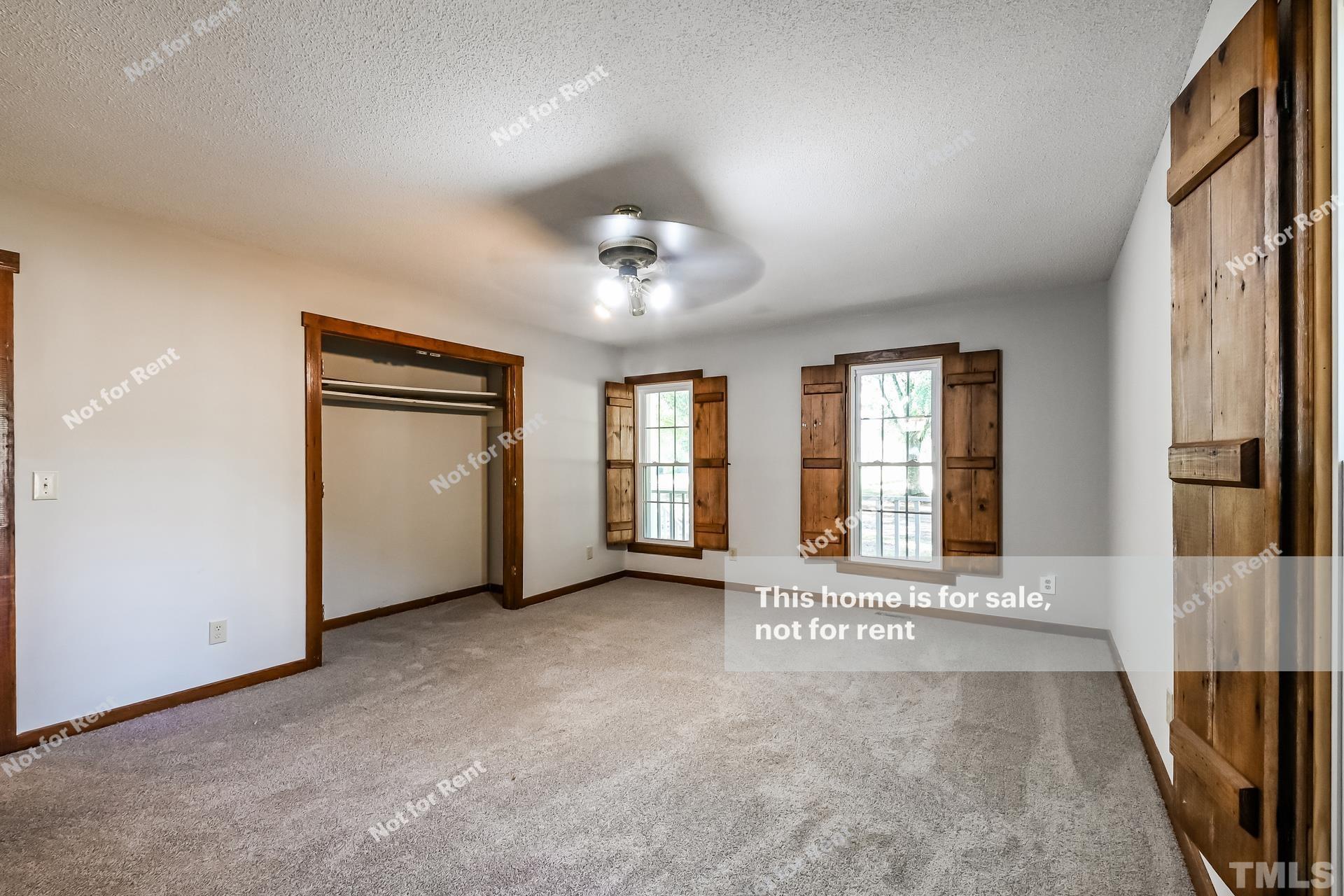 6587 Dwight Rowland Road Willow Spring, NC 27592 - Photo 14 of 25 a view of an empty room with a window