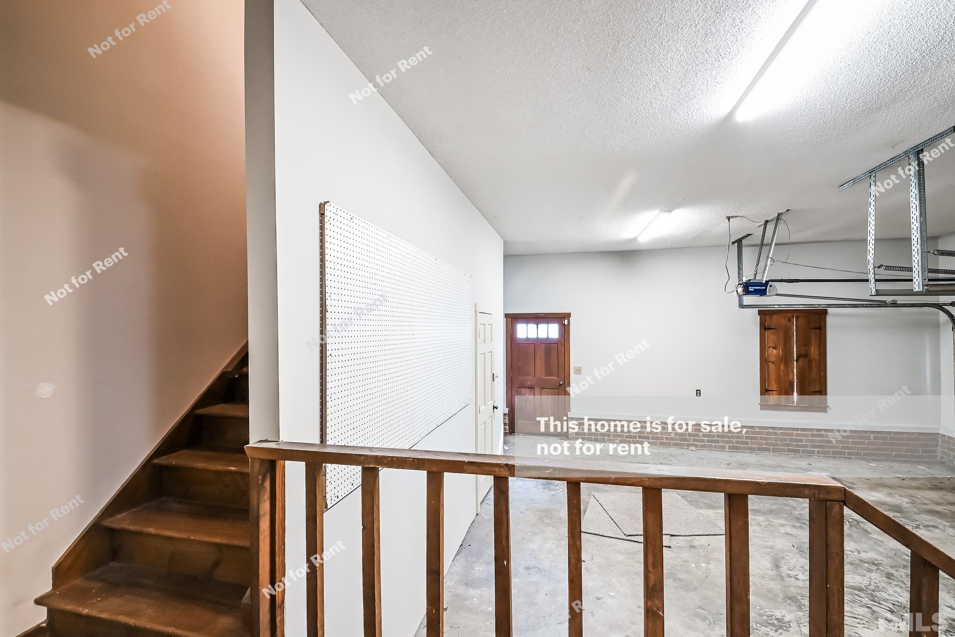 6587 Dwight Rowland Road Willow Spring, NC 27592 - Photo 22 of 25 a view of a kitchen with furniture and staircase