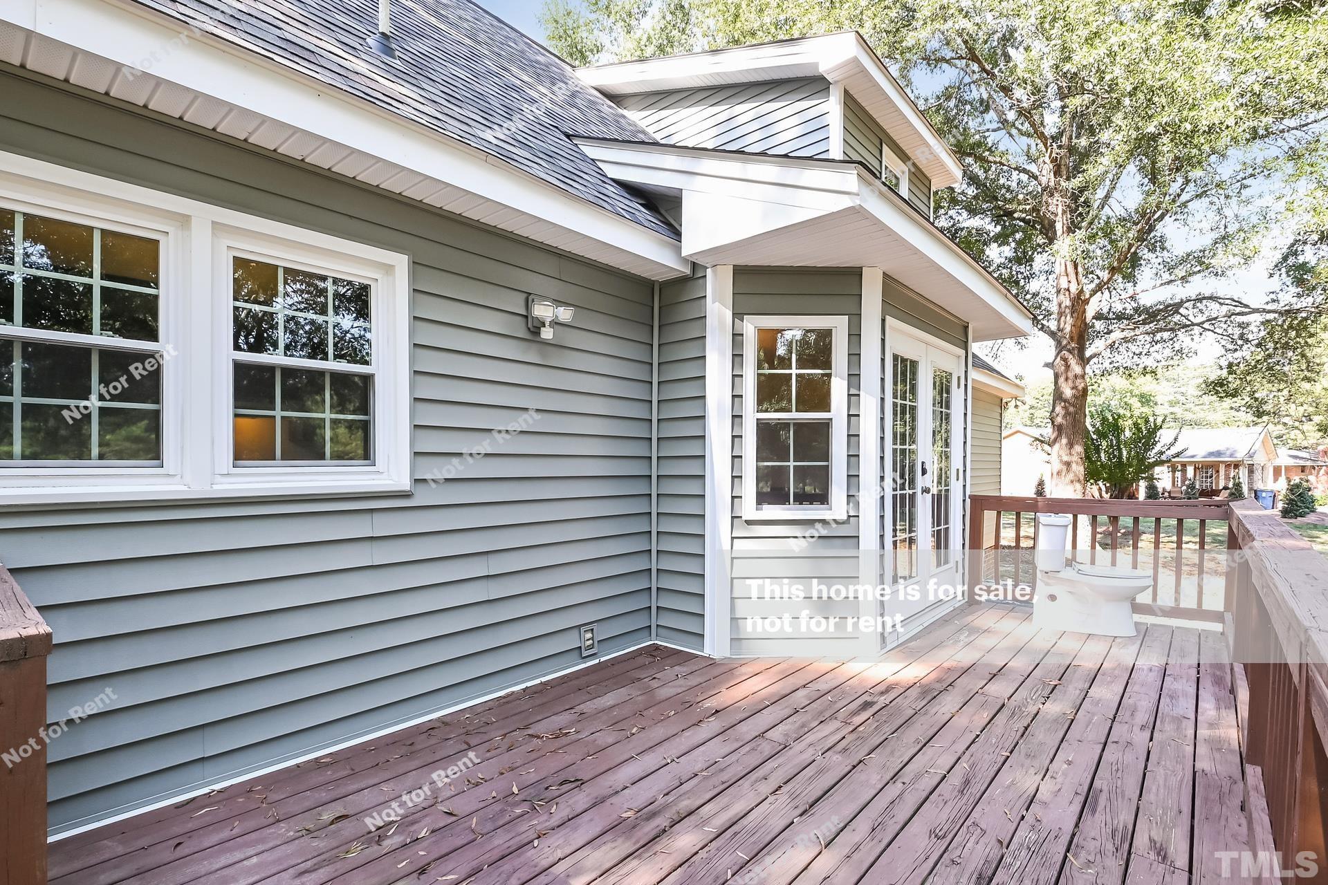 6587 Dwight Rowland Road Willow Spring, NC 27592 - Photo 23 of 25 a view of a house with a roof deck