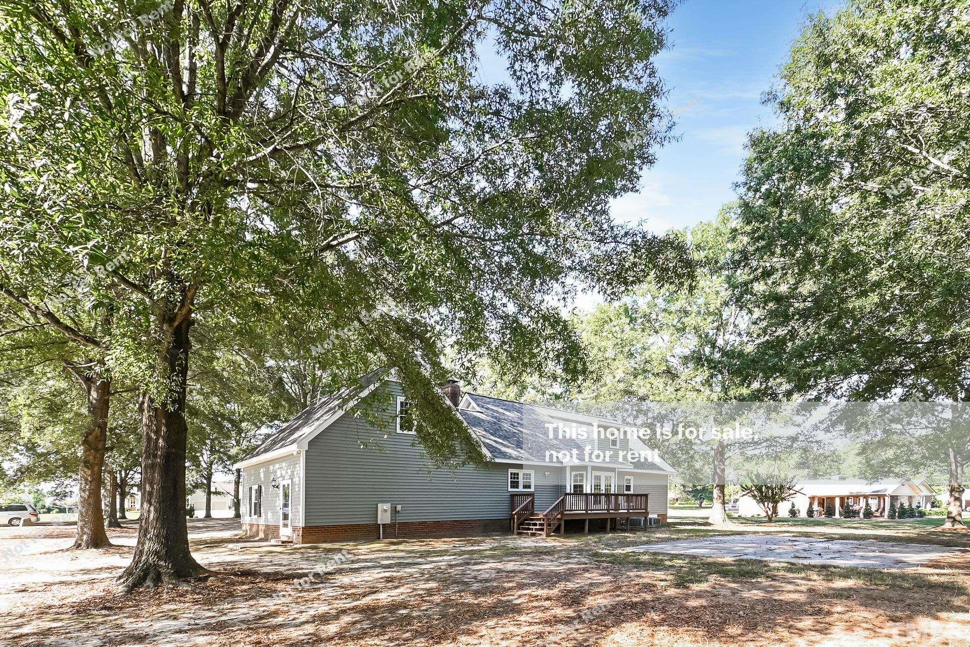 6587 Dwight Rowland Road Willow Spring, NC 27592 - Photo 25 of 25 a view of a house with a outdoor space