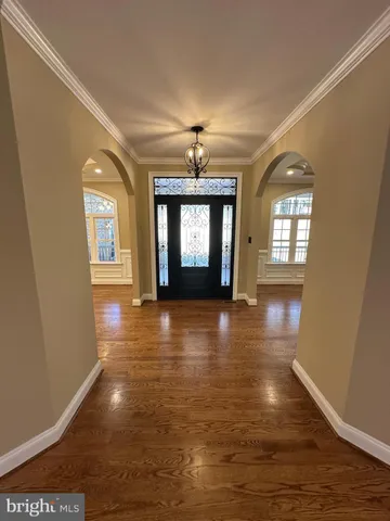 a view of a room with window and wooden floor