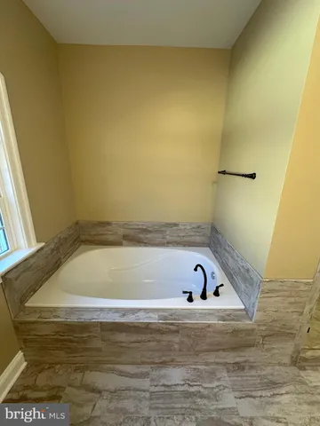 a bathroom with a bathtub