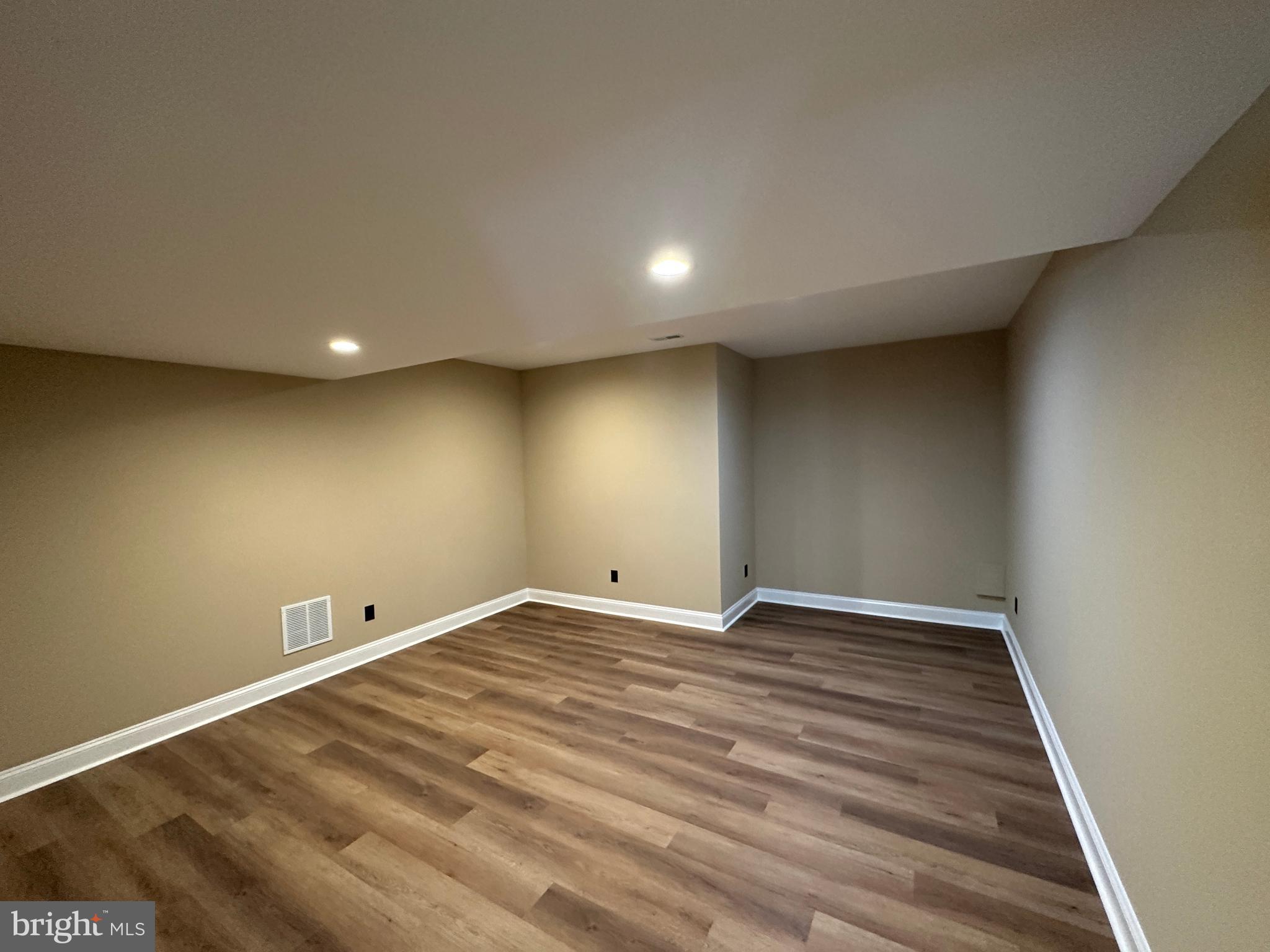 1 Keval Gyan Way Winchester, VA 22603 - Photo 45 of 48 an empty room with wooden floor and windows