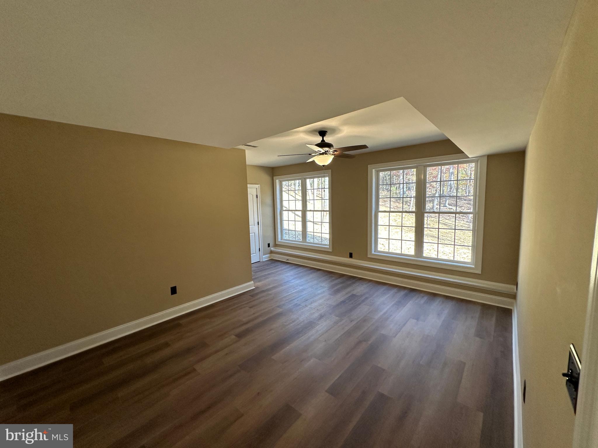 1 Keval Gyan Way Winchester, VA 22603 - Photo 46 of 48 a view of an empty room with wooden floor and a window
