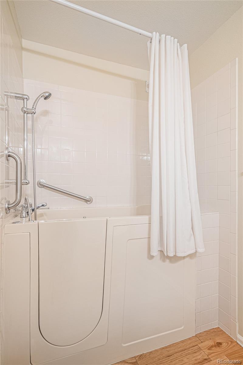 16 Shetland Court Highlands Ranch, CO 80130 - Photo 13 of 25 a view of a room with wooden floor and cabinet