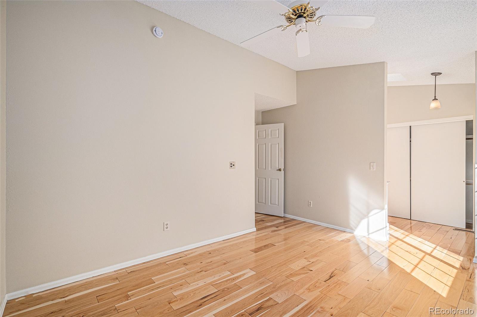 16 Shetland Court Highlands Ranch, CO 80130 - Photo 16 of 25 a view of an empty room with a ceiling fan