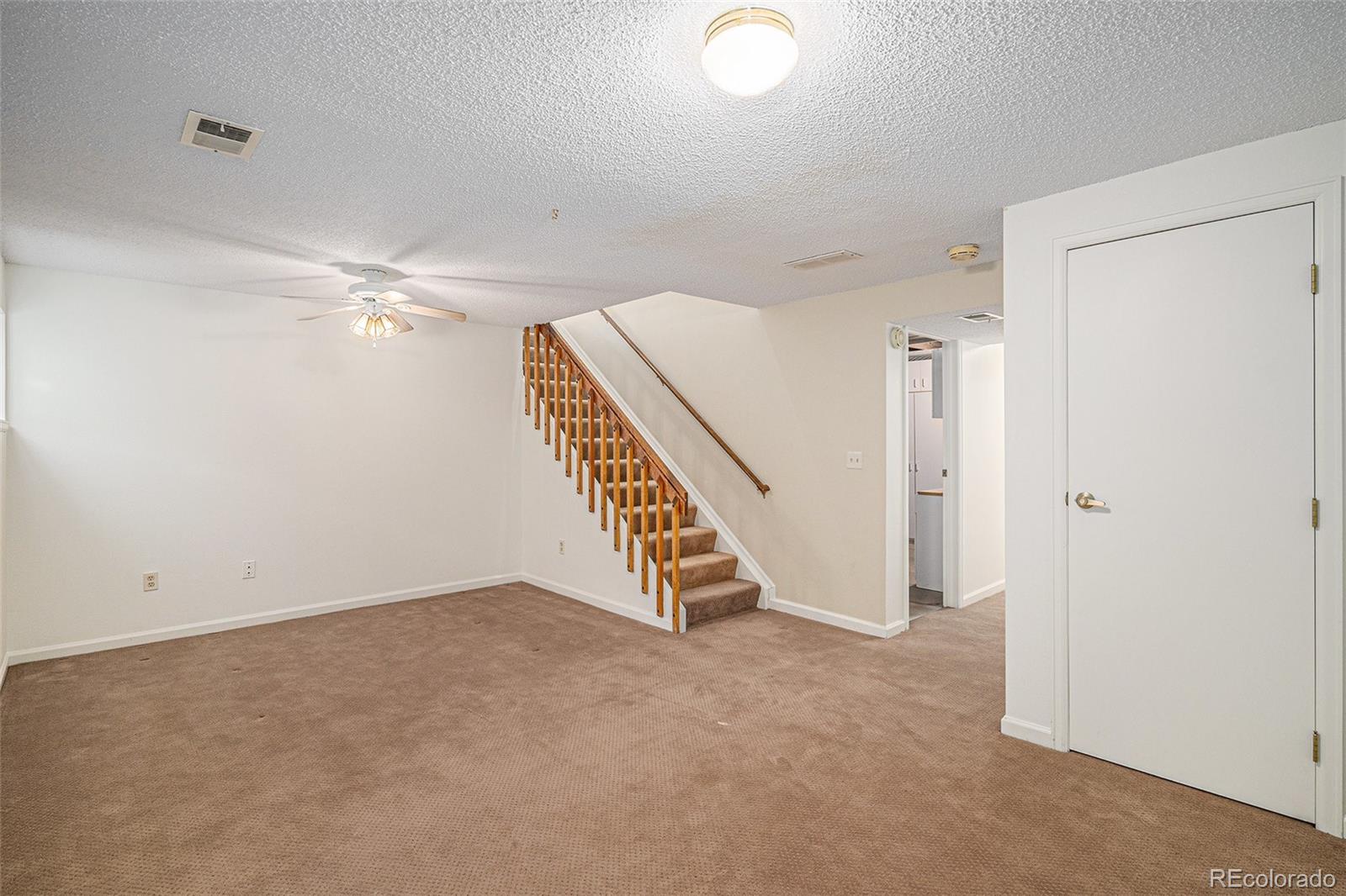16 Shetland Court Highlands Ranch, CO 80130 - Photo 18 of 25 wooden floor in an empty room