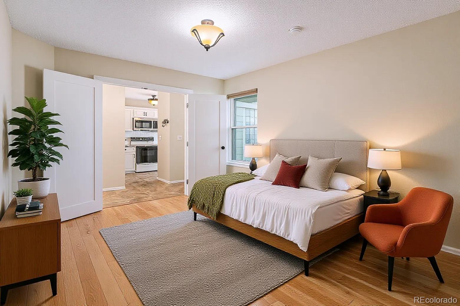 16 Shetland Court Highlands Ranch, CO 80130 - Photo 10 of 25 a bedroom with a bed and a chair