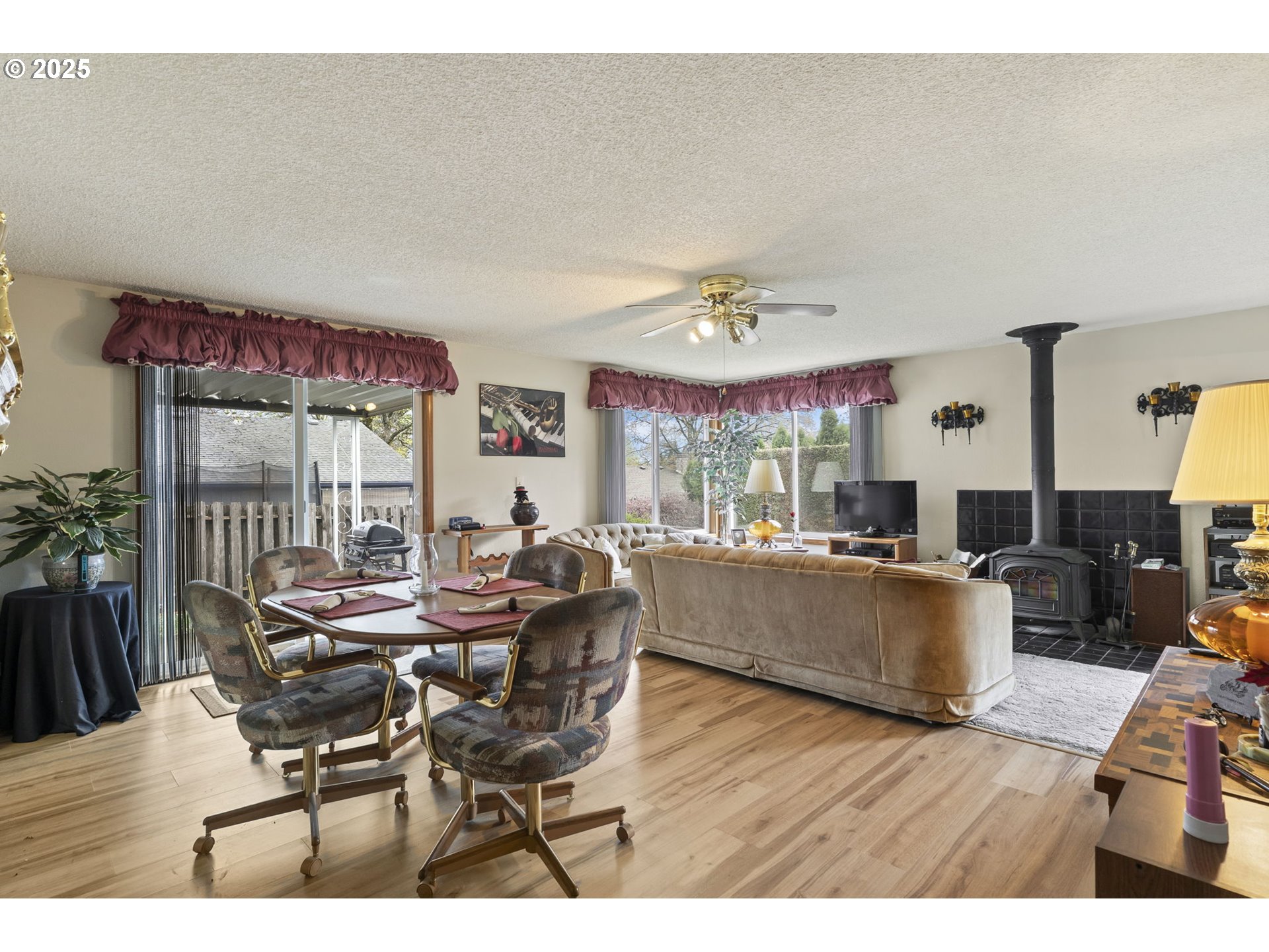 2320 Northeast Juniper Avenue Gresham, OR 97030 - Photo 12 of 34 a view of a dining room with furniture and wooden floor