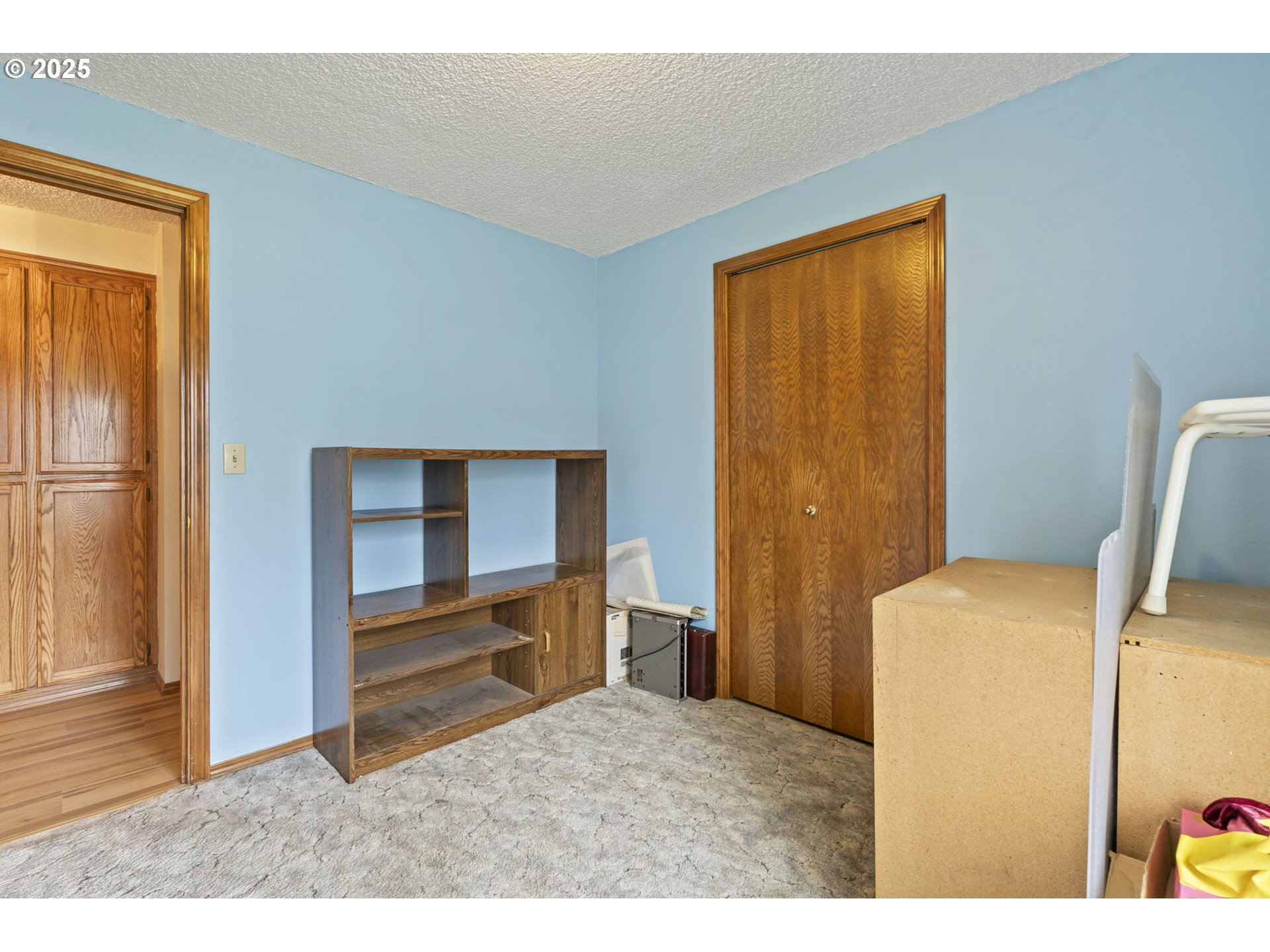 2320 Northeast Juniper Avenue Gresham, OR 97030 - Photo 22 of 34 a bedroom with a bed and a view of kitchen