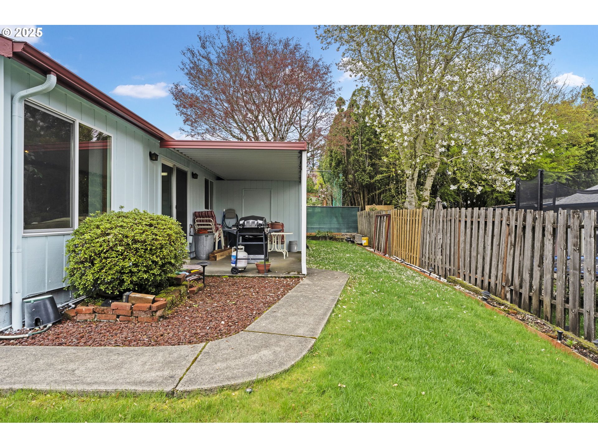 2320 Northeast Juniper Avenue Gresham, OR 97030 - Photo 29 of 34 a view of a house with backyard porch and sitting area