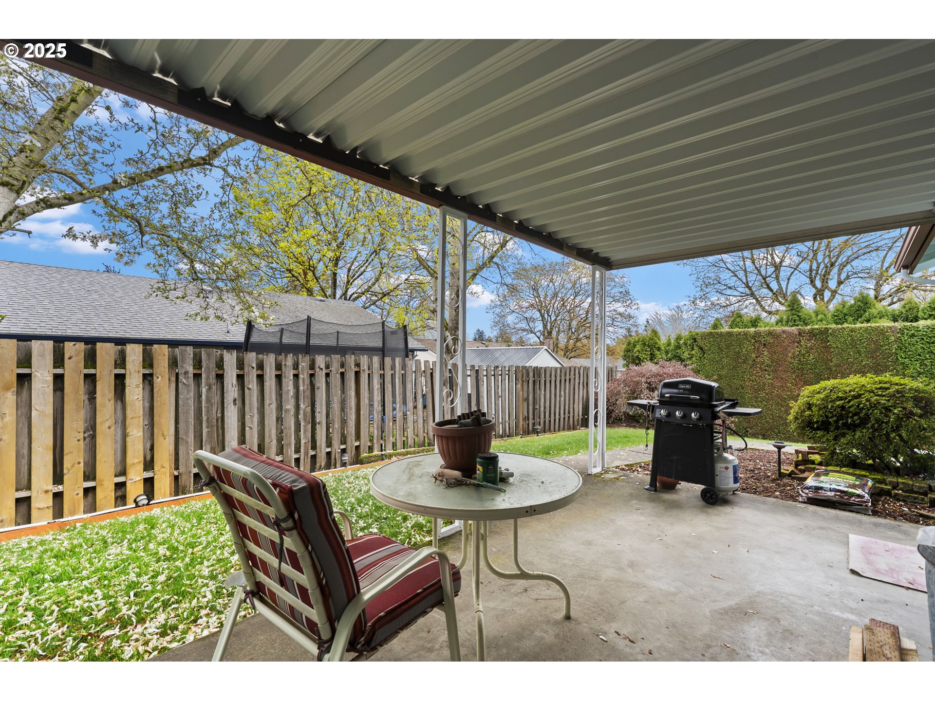 2320 Northeast Juniper Avenue Gresham, OR 97030 - Photo 30 of 34 a backyard of a house with table and chairs