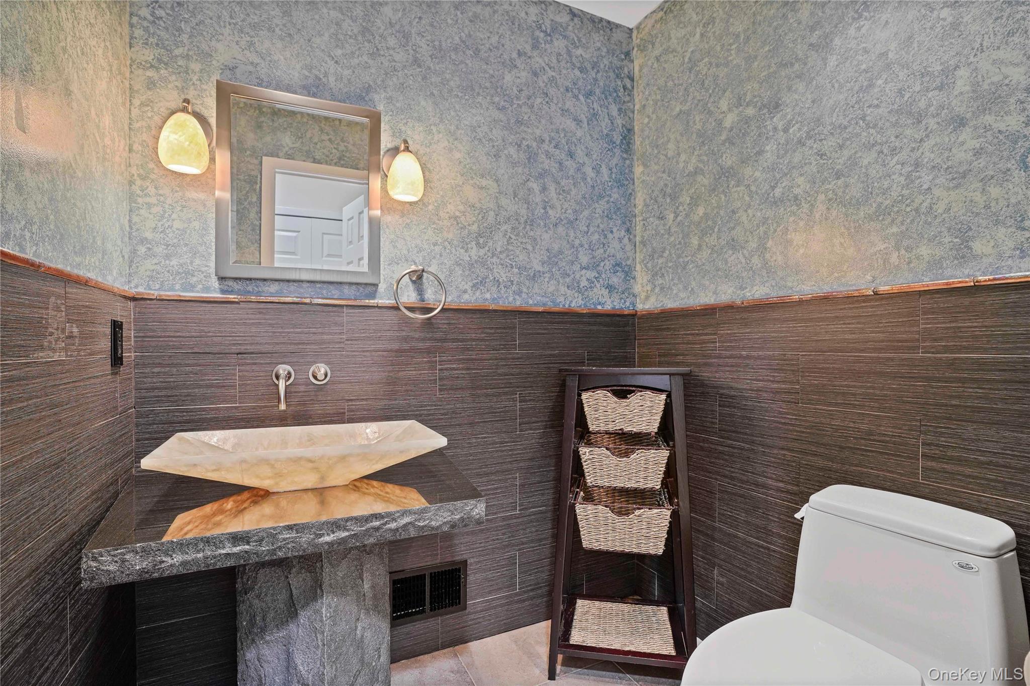 208 Boulder Ridge Road Scarsdale, NY 10583 - Photo 14 of 43 Bathroom featuring a wainscoted wall, tile walls, wallpapered walls, and vanity