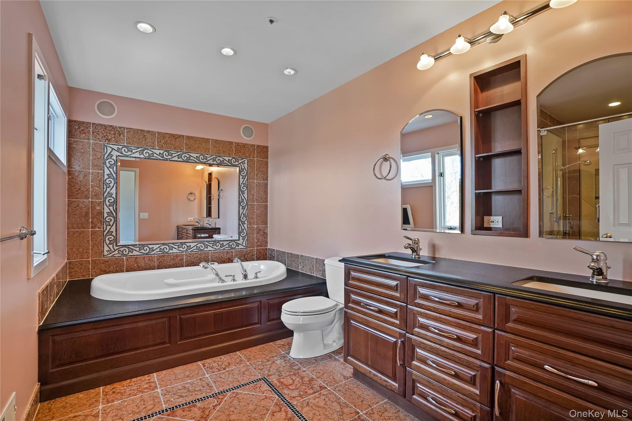 208 Boulder Ridge Road Scarsdale, NY 10583 - Photo 18 of 43 Full bath featuring double vanity, a garden tub, a shower stall, recessed lighting, and light tile patterned floors