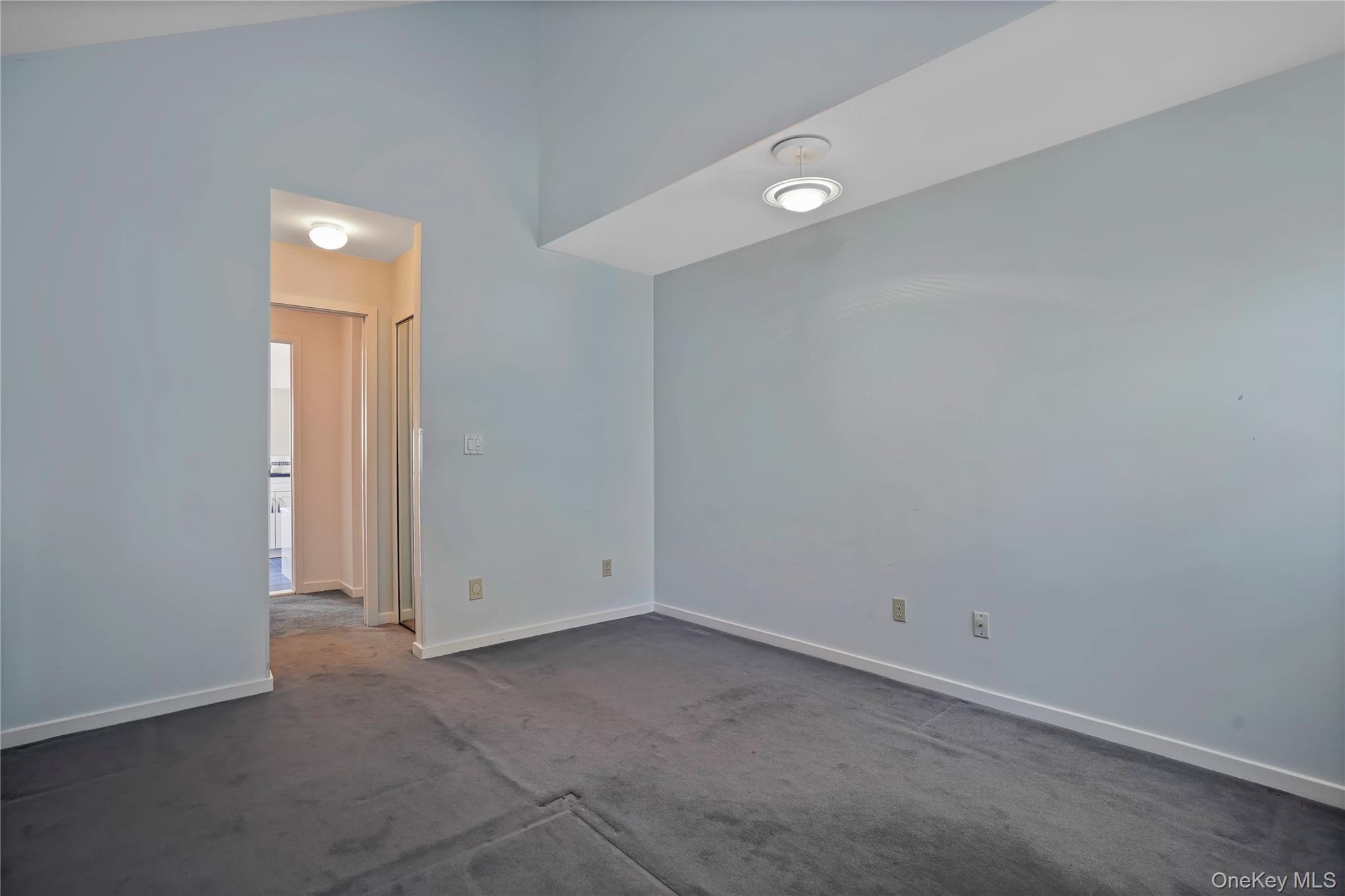 208 Boulder Ridge Road Scarsdale, NY 10583 - Photo 21 of 43 Spare room featuring baseboards and dark colored carpet