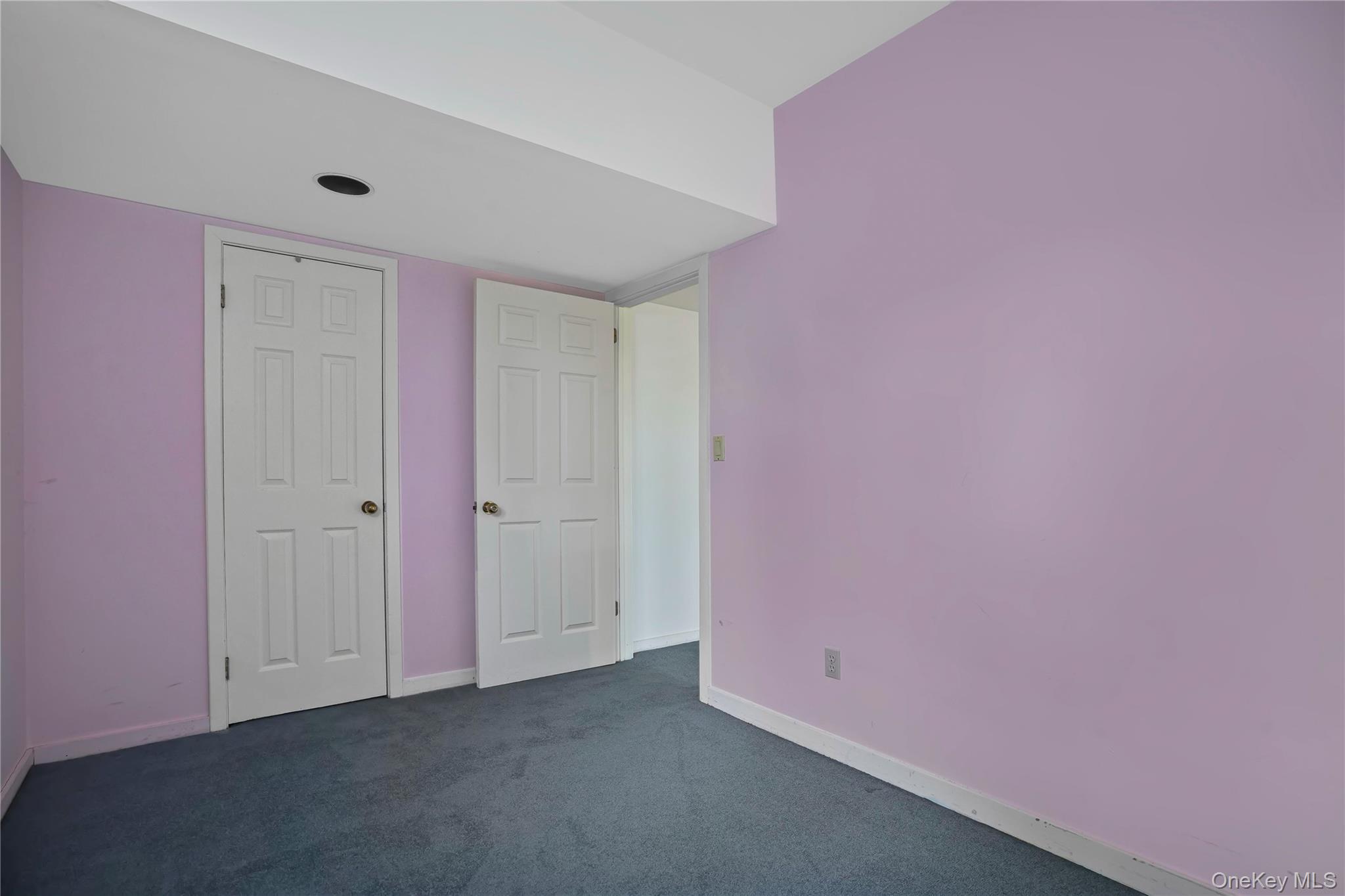 208 Boulder Ridge Road Scarsdale, NY 10583 - Photo 28 of 43 Unfurnished bedroom with dark carpet and a closet