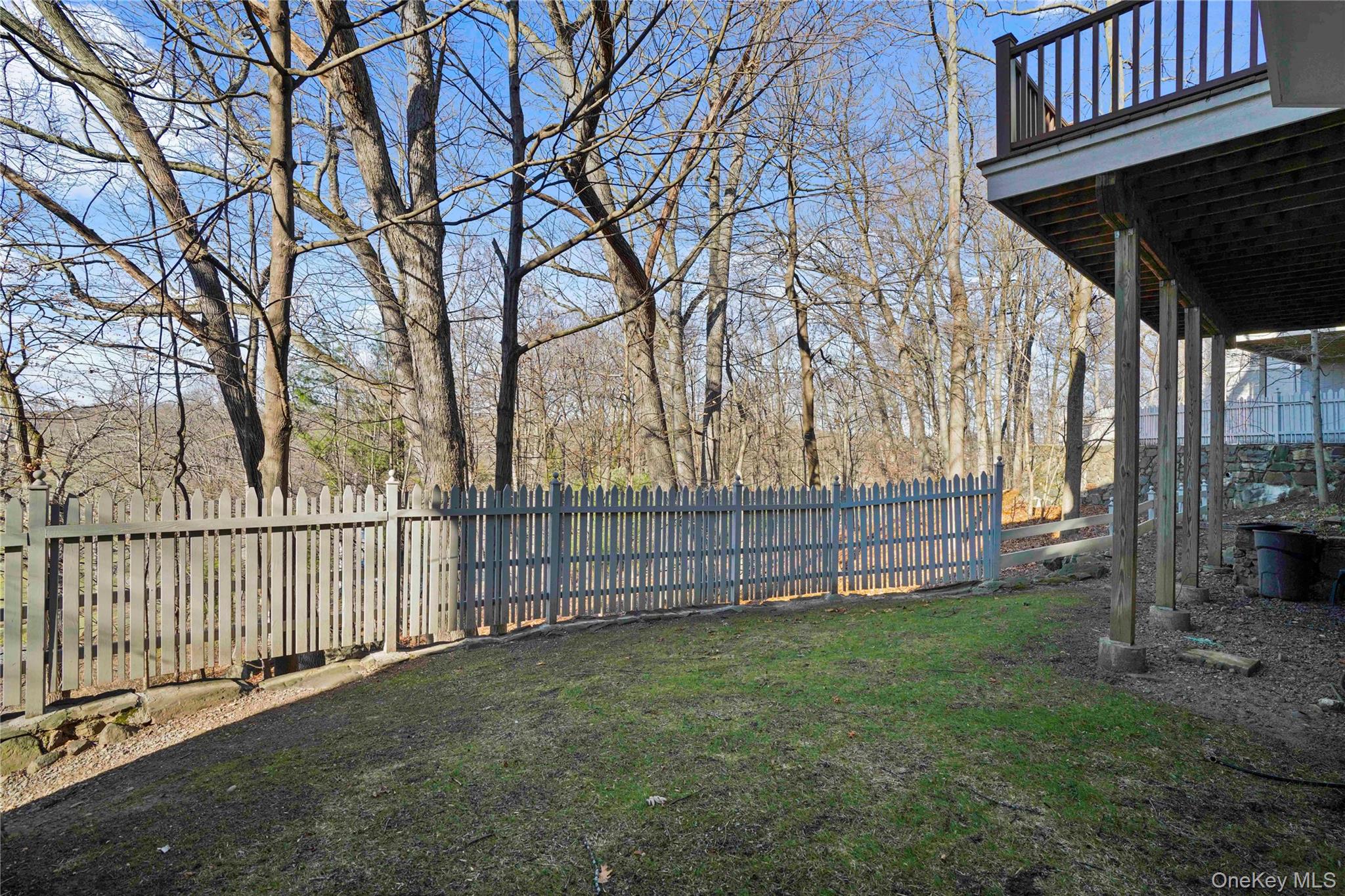 208 Boulder Ridge Road Scarsdale, NY 10583 - Photo 34 of 43 Fenced backyard with a wooden deck