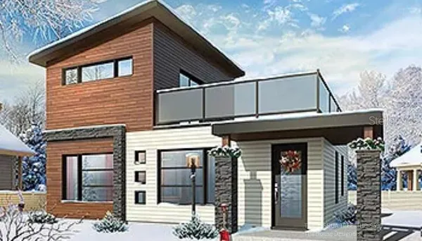 a front view of a house with glass windows and plants