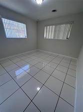 3614 Taylor Street Hollywood, FL 33021 - Photo 11 of 20 a view of an empty room with a window