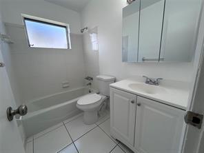 3614 Taylor Street Hollywood, FL 33021 - Photo 2 of 20 a bathroom with a sink a toilet and shower