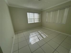 3614 Taylor Street Hollywood, FL 33021 - Photo 4 of 20 an empty room with windows