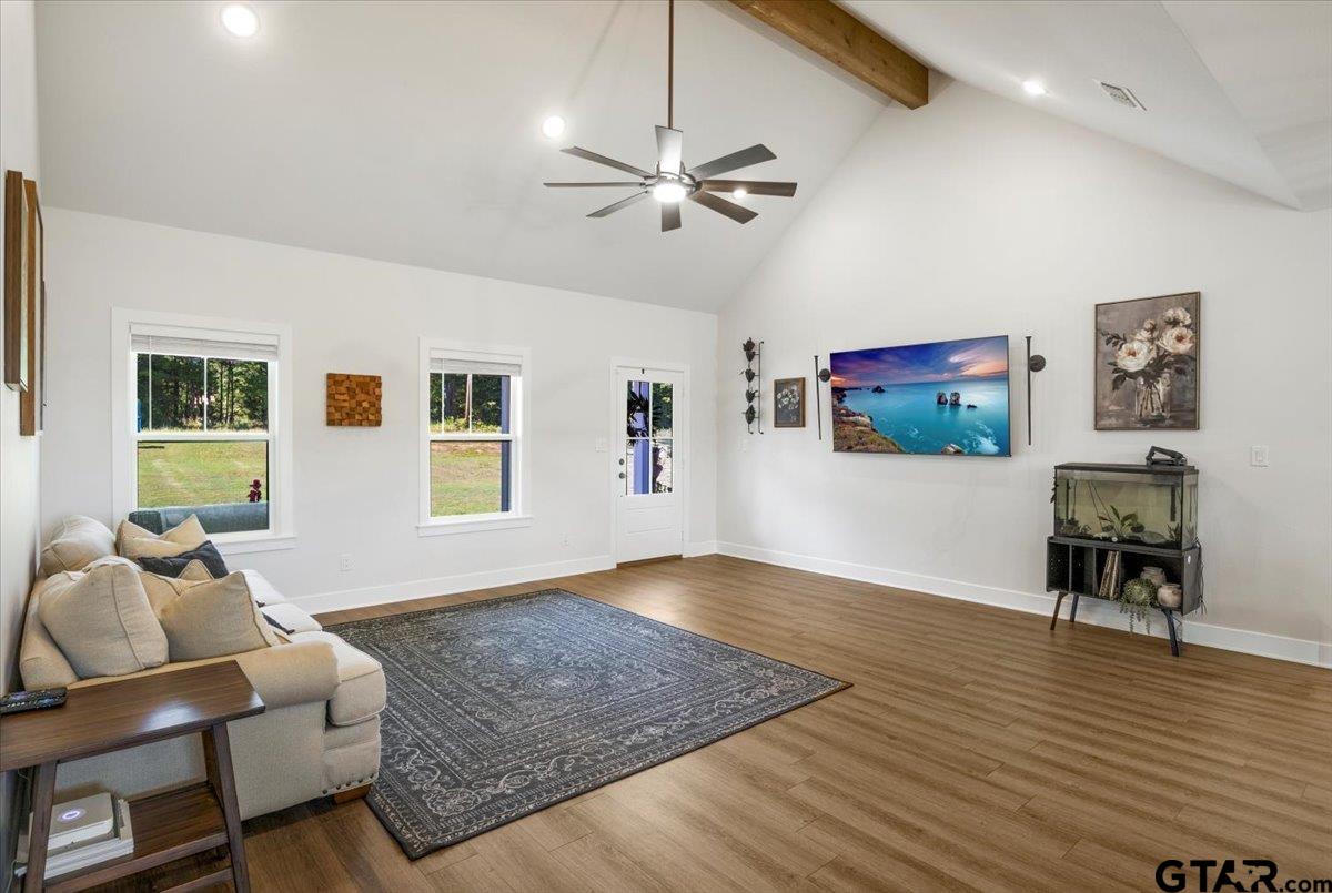 681 Peavine Road Kilgore, TX 75662 - Photo 14 of 27 a living room with furniture and wooden floor