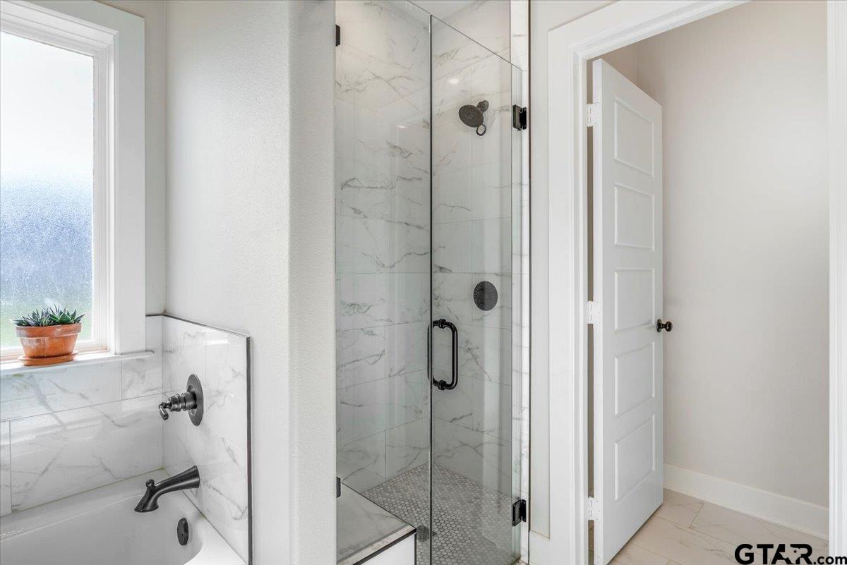 681 Peavine Road Kilgore, TX 75662 - Photo 19 of 27 a bathroom with a shower