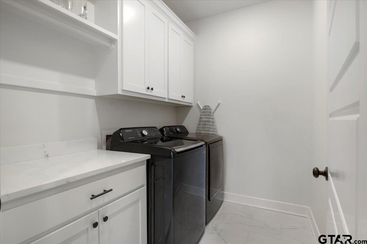 681 Peavine Road Kilgore, TX 75662 - Photo 20 of 27 a utility room with dryer and washer