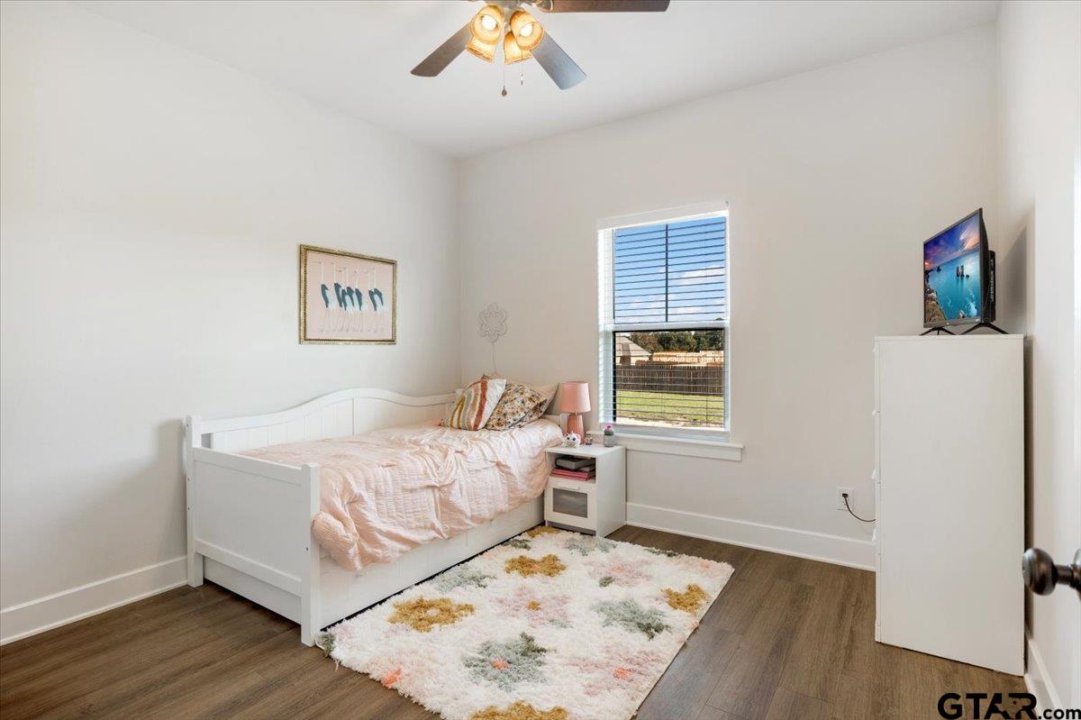 681 Peavine Road Kilgore, TX 75662 - Photo 24 of 27 a bed room with a bed and a window