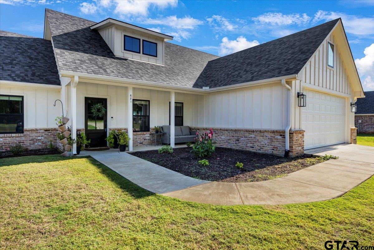 681 Peavine Road Kilgore, TX 75662 - Photo 3 of 27 a view of a house with yard and plants