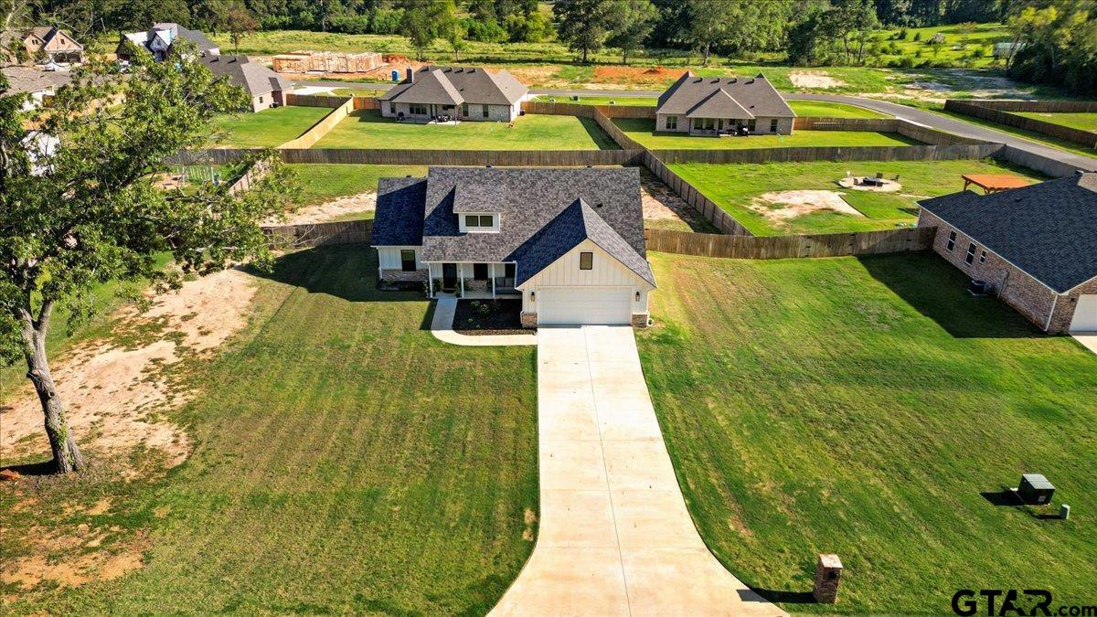 681 Peavine Road Kilgore, TX 75662 - Photo 4 of 27 a view of swimming pool with seating area