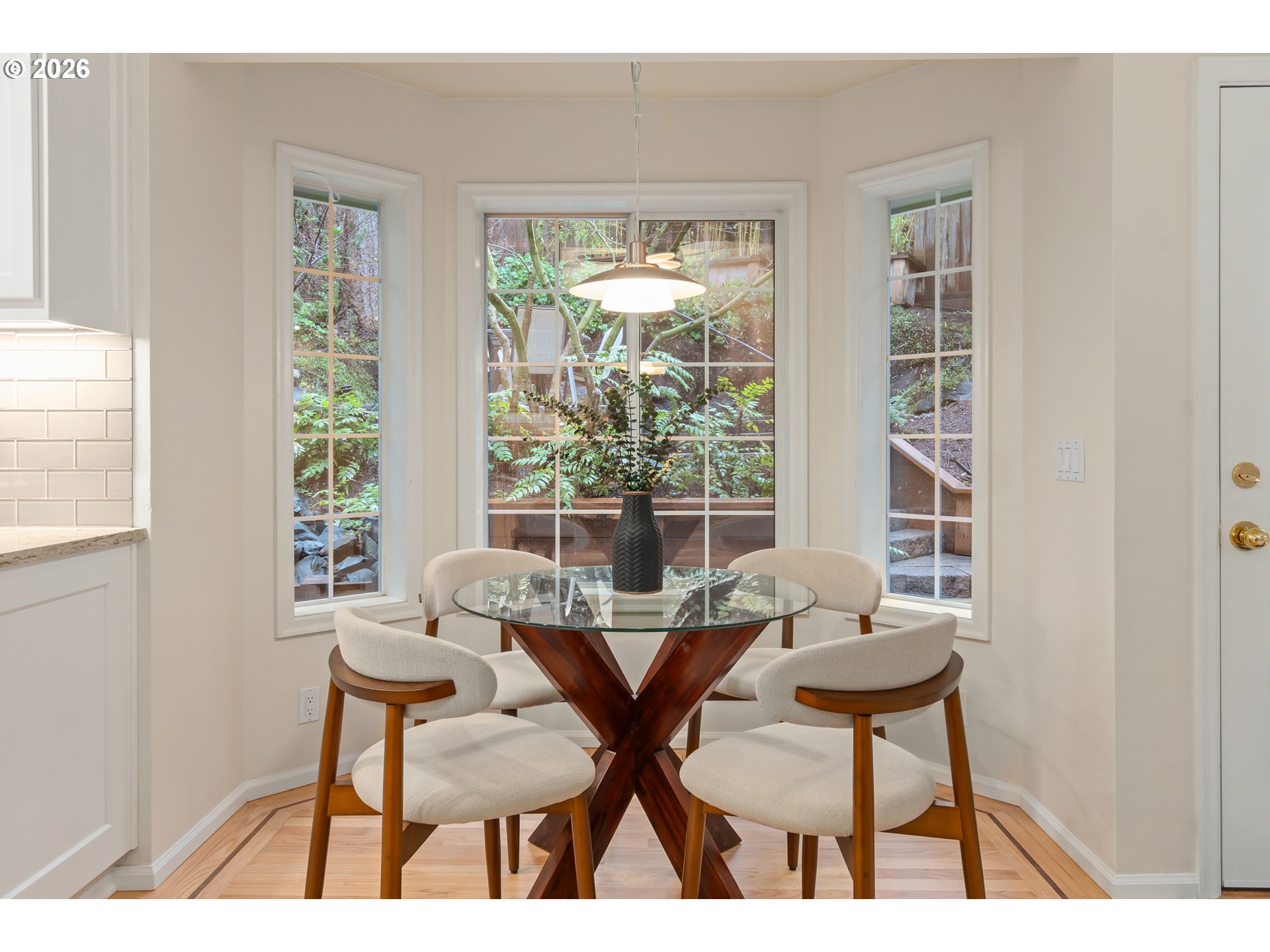 2380 West 28th Avenue Eugene, OR 97405 - Photo 17 of 48 a view of a dining room with furniture and windows