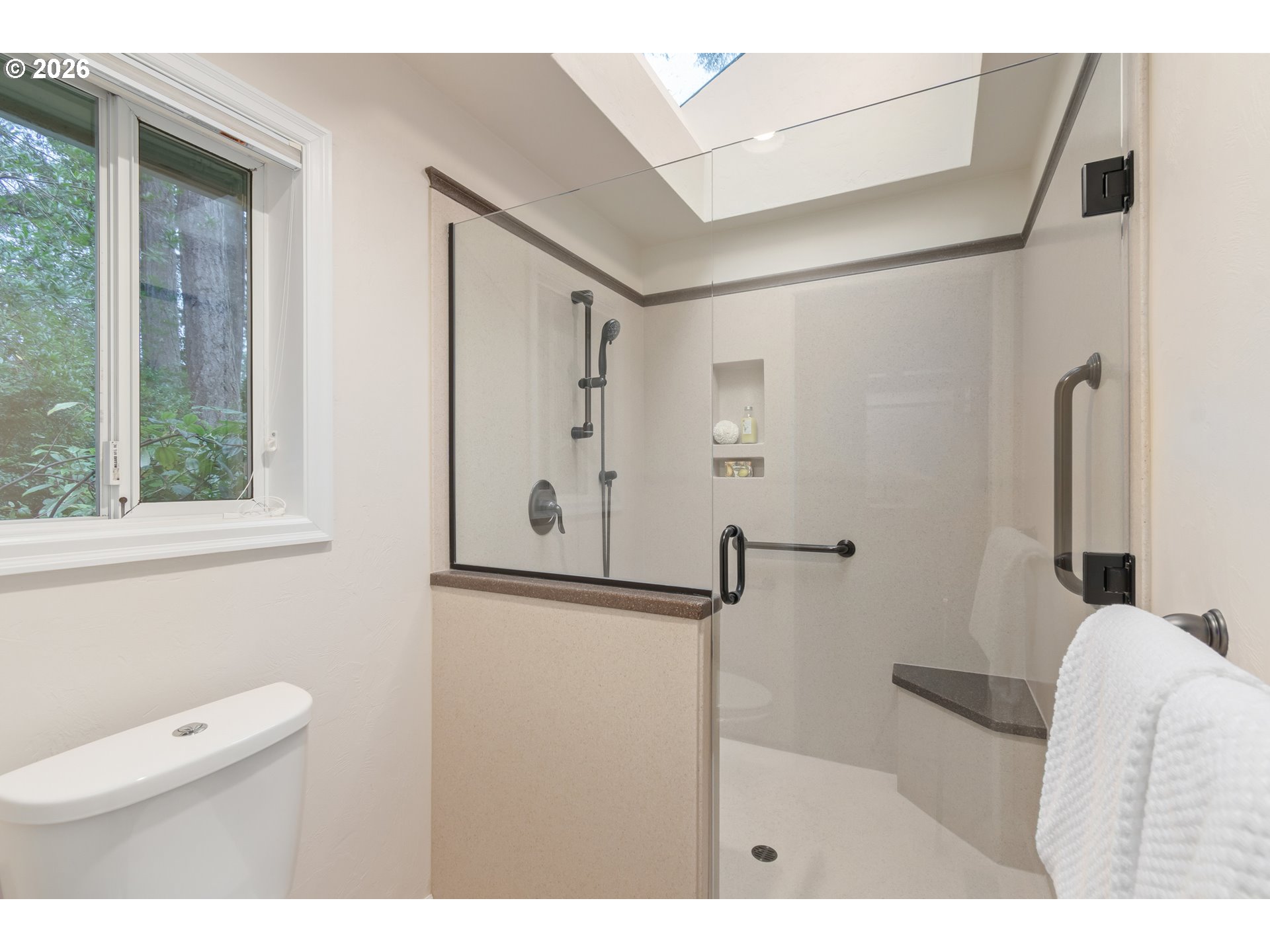 2380 West 28th Avenue Eugene, OR 97405 - Photo 29 of 48 a bathroom with a toilet sink and a shower