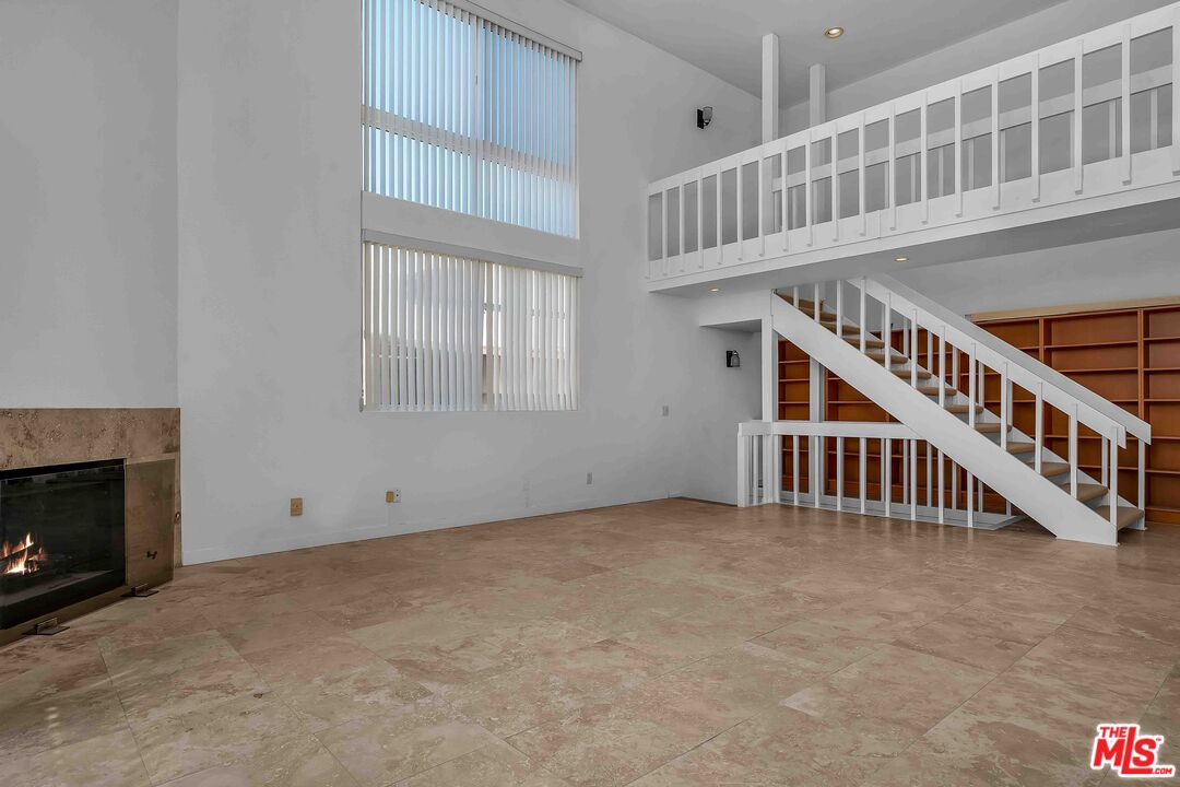 a view of an empty room with stairs