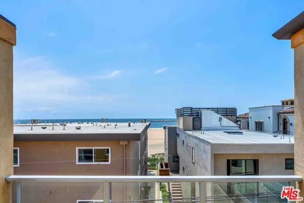 a view of buildings from the balcony