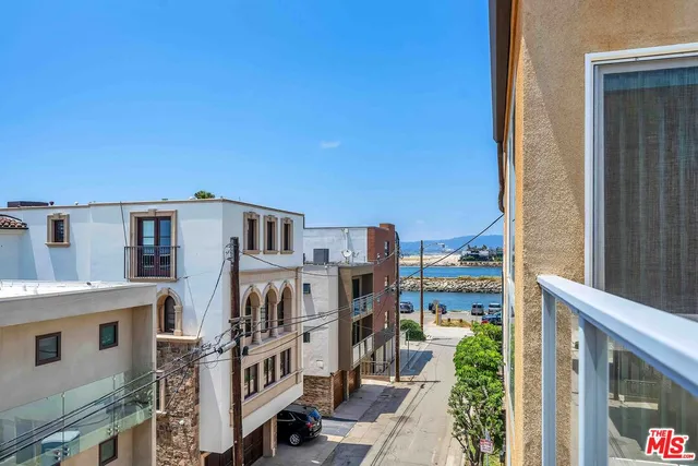 a view of backyard with large windows